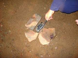 After unstacking a pile of rocks in the middle of the jeep trail, a radio lost elsewhere in the woods was uncovered