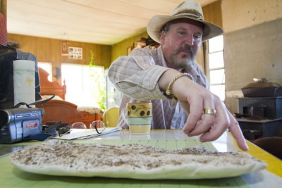 Kirk Stewart displays a cast he made of a large footprint found on his French Hill Road property. The Daily Triplicate/Bryant Anderson