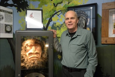 Tourism Harrison executive director Robert Reyerse stands with a replica of a Sts’ailes Band Sasquatch mask in the new Sasquatch Museum at the Visitor Information Centre. Nina Grossman/The Observer